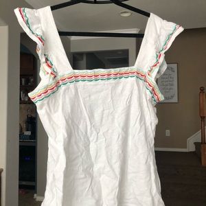 Cute tank with multi-colored embroidered stripes.